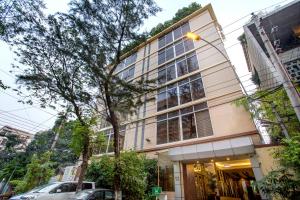 a building with a street light in front of it at Ascott The Residence Dhaka in Dhaka