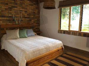 Llit o llits en una habitació de Tribu EcoHostal 37 fotos més