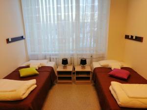 Postel nebo postele na pokoji v ubytování EHE Hostel