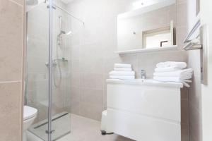 a bathroom with a shower and a sink and a toilet at Guesthouse Mate Ledic in Brela +35 photos