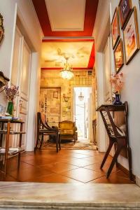 a living room with two chairs and a table at Athens Quinta in Athens