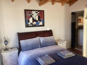 A bed or beds in a room at Cueva Romana Cave House, Clothing Optional, Adult Only
