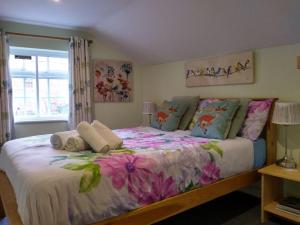 A bed or beds in a room at The Reindeer Inn 