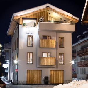 a building in the snow at night at Doris' Nest in Kitzbühel