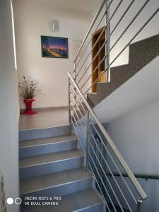 a staircase in a house with a stair railing at Apartment Bernarda in Igrane