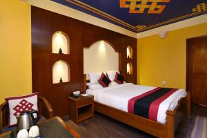Letto o letti in una camera di Karma Boutique Hotel