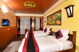 Letto o letti in una camera di Karma Boutique Hotel