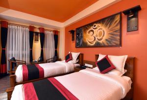 Letto o letti in una camera di Karma Boutique Hotel