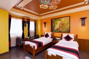 Letto o letti in una camera di Karma Boutique Hotel