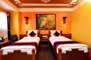 Letto o letti in una camera di Karma Boutique Hotel