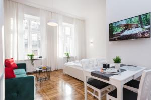 Posteľ alebo postele v izbe v ubytovaní Old Time Apartments
