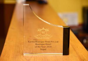 Certificato, attestato, insegna o altro documento esposto da Karma Boutique Hotel