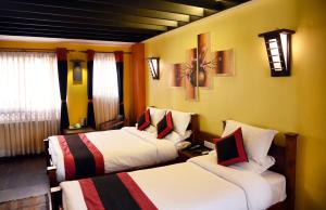 Letto o letti in una camera di Karma Boutique Hotel