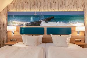 Ένα ή περισσότερα κρεβάτια σε δωμάτιο στο Hotel Blinkfüer