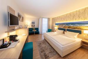 Ένα ή περισσότερα κρεβάτια σε δωμάτιο στο Hotel Blinkfüer