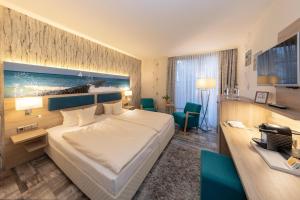 Ένα ή περισσότερα κρεβάτια σε δωμάτιο στο Hotel Blinkfüer