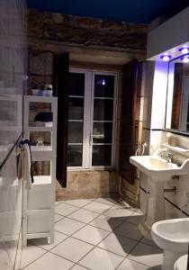 a bathroom with a sink and a toilet at Casa Vilar in Sanxenxo