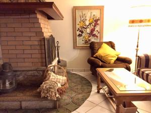 a living room with a couch and a fireplace at Casa Vilar in Sanxenxo