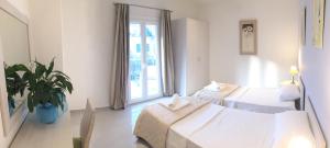 Ένα ή περισσότερα κρεβάτια σε δωμάτιο στο The Central Suites