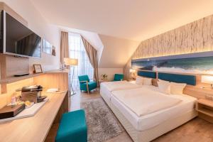 Ένα ή περισσότερα κρεβάτια σε δωμάτιο στο Hotel Blinkfüer