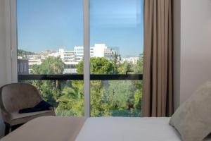 Posteľ alebo postele v izbe v ubytovaní B4B Athens 365