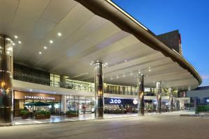 a large building with a shopping center at Swiss-Belhotel Airport Jakarta in Tangerang