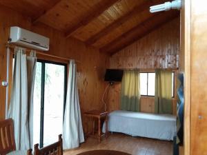 Ein Bett oder Betten in einem Zimmer der Unterkunft Cabañas de Campo Colbún