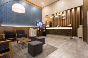 TV a/nebo společenská místnost v ubytování Vella Suite Hotel