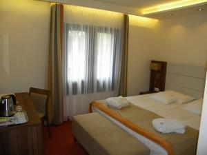 Voodi või voodid majutusasutuse Bükkös Hotel & Spa toas
