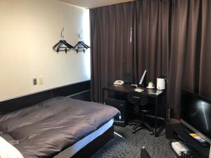Un pat sau paturi într-o cameră la Business Stay