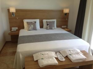 A bed or beds in a room at Rhapsody Hotel Kas