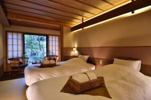 Krevet ili kreveti u jedinici u okviru objekta Yasaka Yutone Kyokoyado
