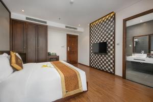 Postelja oz. postelje v sobi nastanitve Cosmos Hotel Danang
