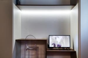 Televízia a/alebo spoločenská miestnosť v ubytovaní Antico Caminetto alla Biennale
