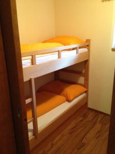 Postel nebo postele na pokoji v ubytování Appartements am See