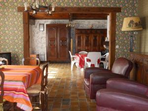 a living room with a table and chairs and a dining room at La palombe in Mimizan-Plage