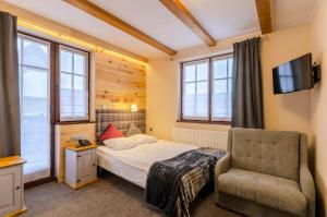 Кровать или кровати в номере Vital&Spa Resort Szarotka +57 фотографий