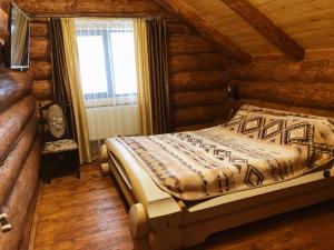 Postel nebo postele na pokoji v ubytování Зимова казка