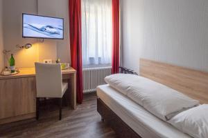 Postel nebo postele na pokoji v ubytování Hotel Westerfeld