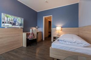 Postel nebo postele na pokoji v ubytování Hotel Westerfeld