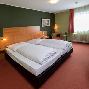 Postel nebo postele na pokoji v ubytování Hotel Westerfeld
