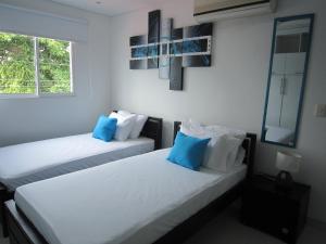 Postel nebo postele na pokoji v ubytování Hotel Valmar