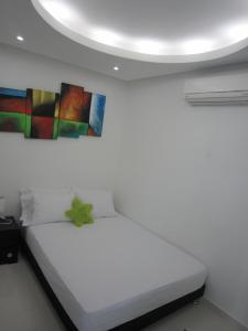Postel nebo postele na pokoji v ubytování Hotel Valmar