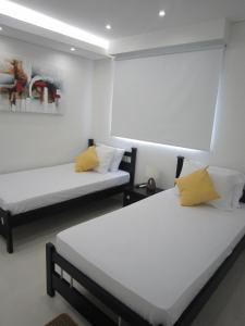 Postel nebo postele na pokoji v ubytování Hotel Valmar