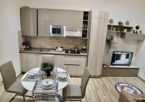 A kitchen or kitchenette at Central Lepetit apartment De Luxe