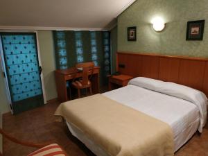 Postel nebo postele na pokoji v ubytování Hotel Real de Castilla