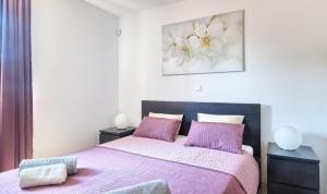 سرير أو أسرّة في غرفة في Apartment Peninsula
