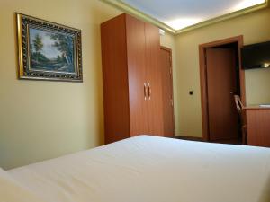 Postel nebo postele na pokoji v ubytování Hotel Real de Castilla
