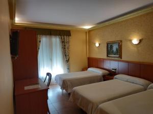 Postel nebo postele na pokoji v ubytování Hotel Real de Castilla