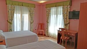 Postel nebo postele na pokoji v ubytování Hotel Real de Castilla